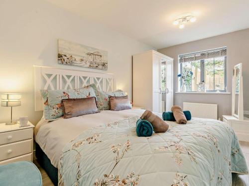 a bedroom with a large bed with pillows on it at 3 Bed in St. Austell oc-90218 in Charlestown