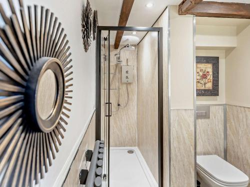 a bathroom with a shower and a toilet at 4 Bed in Bodmin oc-90215 in Bodmin