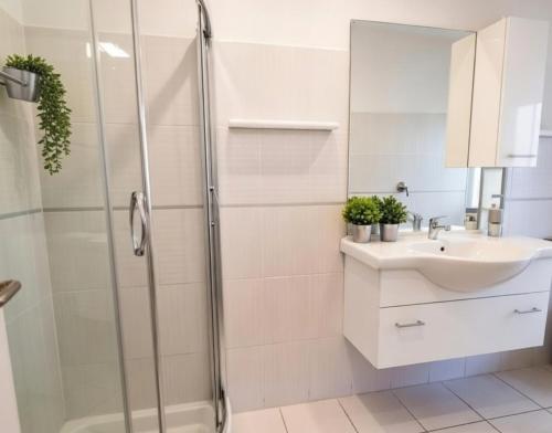 a bathroom with a shower and a sink at ALBACHIARA INN Residence Apartments in Ameglia