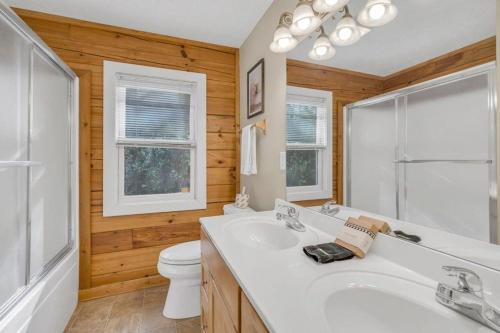 a bathroom with a white sink and a toilet at Scooby Shack in Blowing Rock