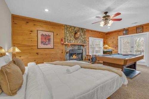 a bedroom with a large bed and a fireplace at Scooby Shack in Blowing Rock