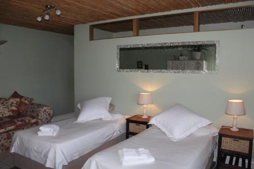 Katil atau katil-katil dalam bilik di Bluebottle Guesthouse