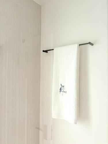 a towel hanging on a towel rack in a bathroom at Arc On Ray 31 in Britannia Bay