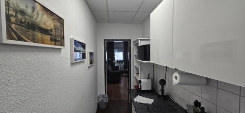 an office hallway with white walls and a hallway with a hallway at City NOWA in Nuremberg