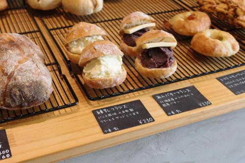 a display of pastries on a tray in a bakery at 新築貸し切り宿 Karatsu House B in Karatsu
