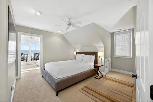 a bedroom with a bed with a ceiling fan at EA1A: 1A Eugenia Avenue in Kiawah Island