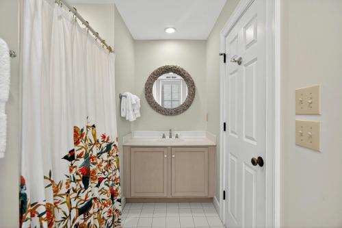 a bathroom with a sink and a mirror at EA1A: 1A Eugenia Avenue in Kiawah Island