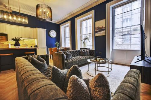 a living room with a couch and a table at Wilton House in Belfast