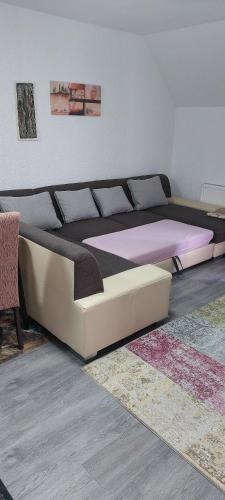 a bed in a room with a bed frame at Koblenz Asterstein Ferienwohnung in Koblenz