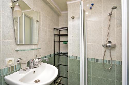 a bathroom with a sink and a shower at Apartment On Saryan Street in Yerevan