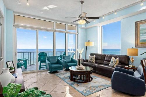a living room with a couch and a table at Sapphire Beach - Breathtaking 26th Floor Views in South Padre Island