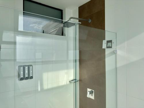a shower with a glass door in a bathroom at 2003 Poblado TOP apartamento in Medellín