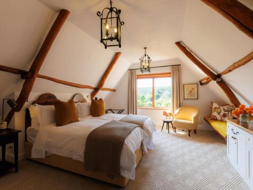 a bedroom with a large bed and a window at Navarre Residence in Stellenbosch