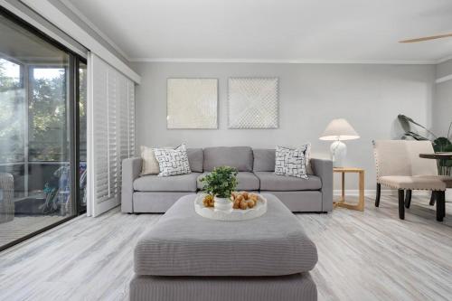 a living room with a couch and a table at Ocean Creek Amazing Resort Amenities in Myrtle Beach