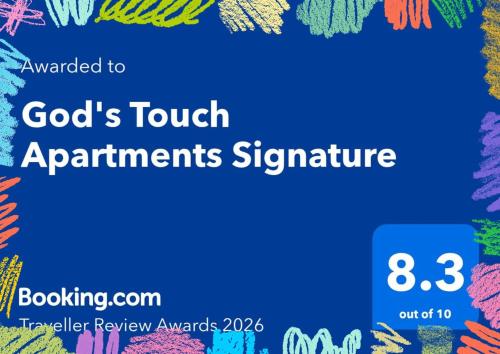 a sign that reads gods touch apartments signature with a background of colorful text at God's Touch Apartments Signature in Lagos