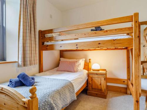 a bedroom with two bunk beds and a ladder at 2 Bed in Fowey oc-55383 in Golant
