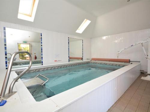 a large swimming pool in a building at 2 Bed in Fowey oc-55383 in Golant