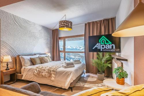 a bedroom with a bed and a sign on the wall at ALPHIRA - Vista Montagne e Deposito per Sci e Bici in Pila