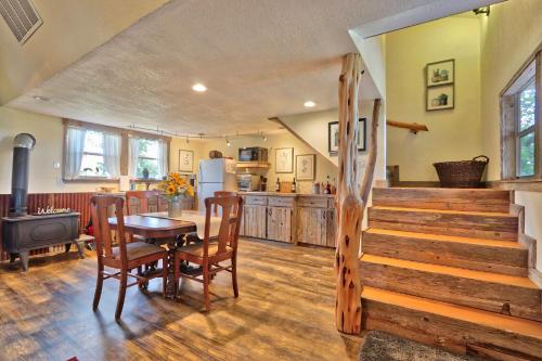 a kitchen and dining room with a table and chairs at Sunflower Ridge Cabin in San Marcos