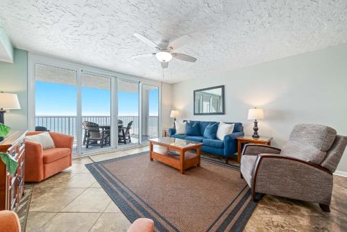 a living room with a couch and chairs and a table at Romar Tower Unit 9D in Orange Beach