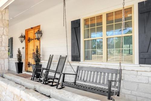two chairs on the porch of a house at Stone Ridge Retreat in Canyon Lake
