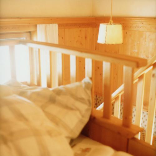 Cama o camas de una habitación en Alfonsstüberl - Ferienwohnungen & Restaurant