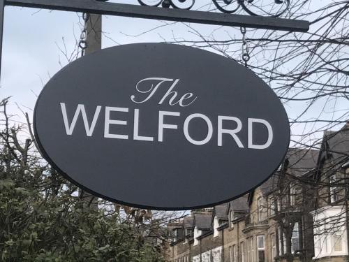 a sign that reads the wellor in front of a building at The Welford in Harrogate