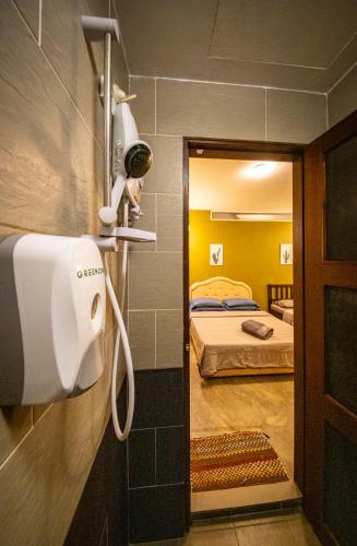 a room with a room with two beds at The Cottage Stay - self check-in in Kuching