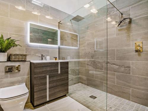 a bathroom with a toilet and a glass shower at 2 Bed in Driffield oc-88238 in Lund