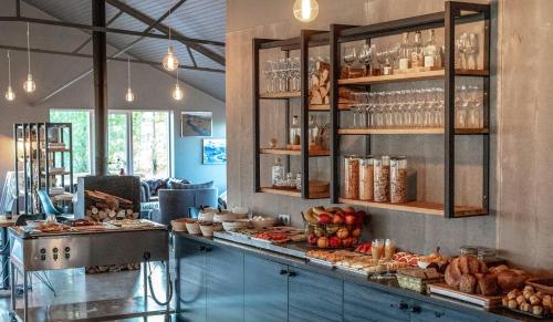 a bakery with a counter with bread and other foods at Litli Geysir Hotel in Haukadalur