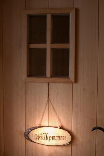 a sign that says wildlife command hanging from a wall at Pfenniggeiger-Hütte in Philippsreut