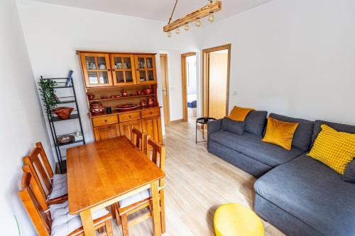 a living room with a couch and a table at Guest H4U - Garden & Beach Mindelo in Mindelo