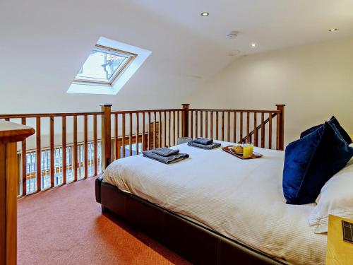 a bedroom with a bed with a tray of food on it at 1 Bed in Doncaster oc-93769 in Mattersey