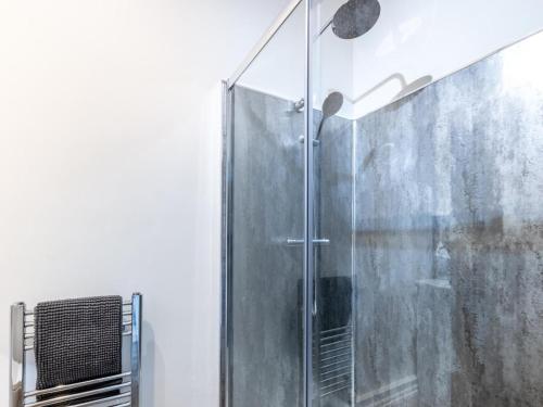 a shower with a glass door in a bathroom at 3 Bed in Doncaster oc-93570 in Mattersey