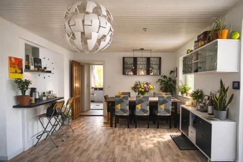 a dining room and kitchen with a table and chairs at Entire house only 20 min from Copenhagen center in Tåstrup