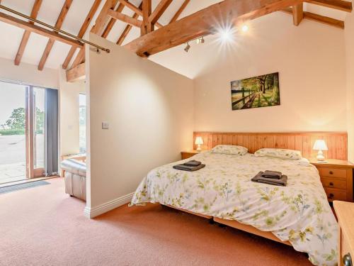 a bedroom with a bed and a large window at 1 Bed in Doncaster oc-93572 in Mattersey