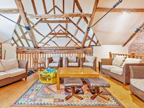 a living room with couches and a table at 1 Bed in Doncaster oc-93571 in Mattersey