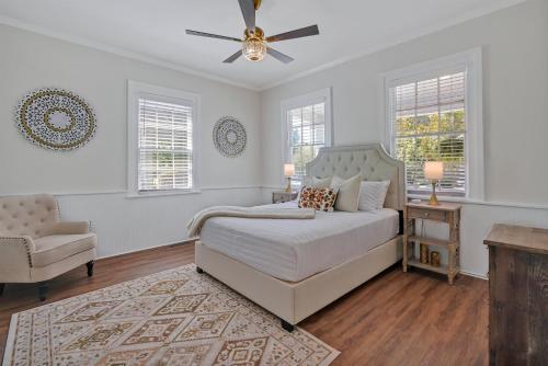 a bedroom with a bed and a ceiling fan at Downtown Bliss in Wilmington