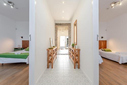เตียงในห้องที่ Casas do Vale -T2