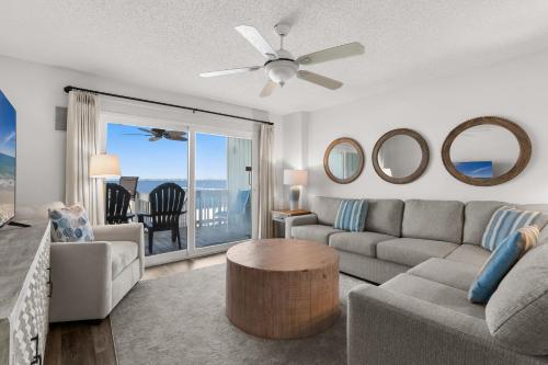 a living room with a couch and a table at Boardwalk Unit E4 in Pensacola Beach