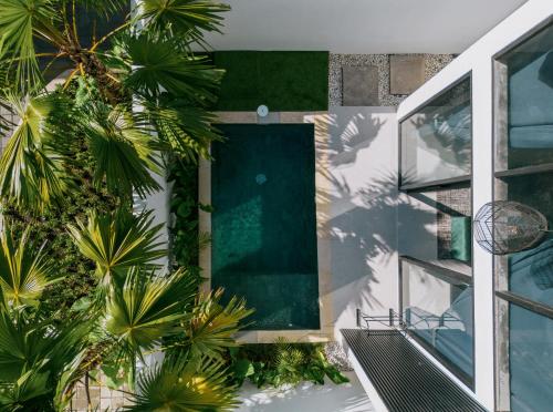 an aerial view of a house with a swimming pool at Paniora Loft Villas in Kuta Lombok