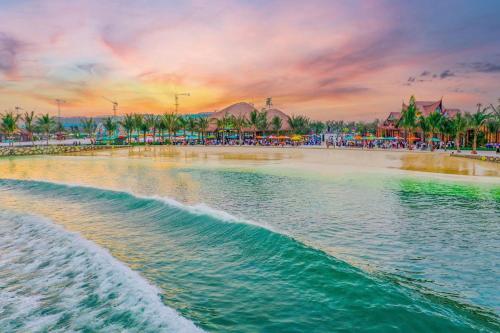 a painting of the beach at a resort at sunset at Thanh hoa HOMESTAY in Hòa Bình
