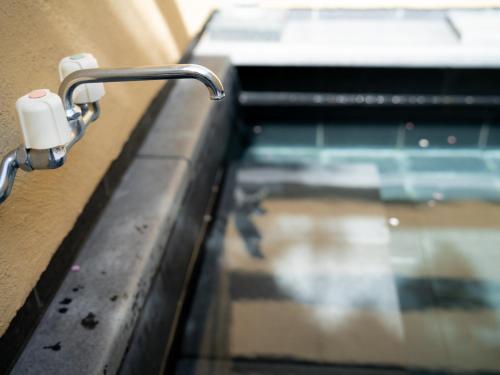 a close up of a metal handle on a window at バケーションイン伊豆高原 in Ito