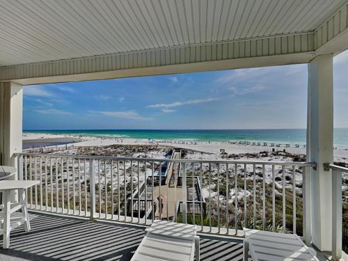 a balcony with a view of the beach at Commodores Retreat #205 in Santa Rosa Beach