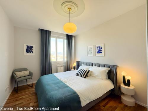 a bedroom with a bed and a pendant light at Saverio & Daria Aprtements by Mamo Florence in Florence