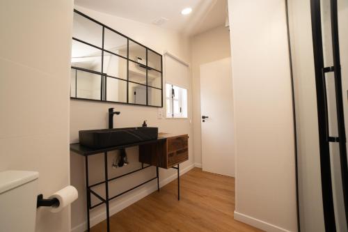 a bathroom with a sink and a mirror at Sarridal, Lar Atlántico in Cedeira