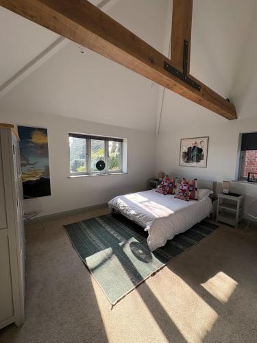a bedroom with a bed in the middle of a room at Knowle Grange Guest House in Frant