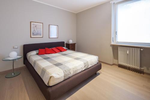 Un pat sau paturi într-o cameră la Residenza Callas II