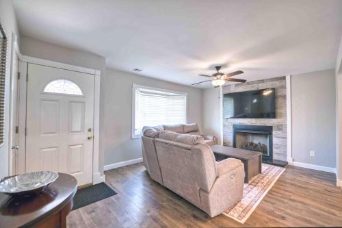 a living room with a couch and a fireplace at Waterfront oasis 3BR Game Room Pet Friendly in Little Egg Harbor Township