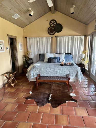 a bedroom with a large bed in a room at Around the Bend Bungalow in Fredericksburg